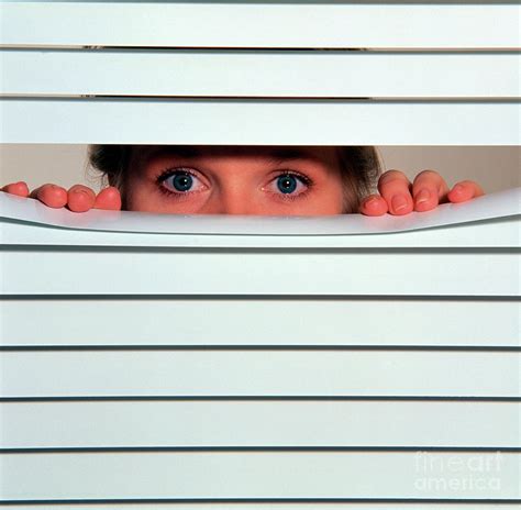 A Woman S Eyes Looking Between Slats Of A Blind Photograph By Damien Lovegrove Science Photo