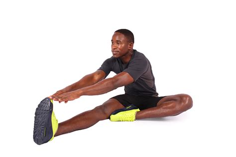 Fitness Man Touching Toes To Stretch Leg Muscles Stretching Hamstrings