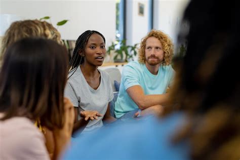 Premium Photo Group Of Diverse People Sitting On Sofa And Talking In