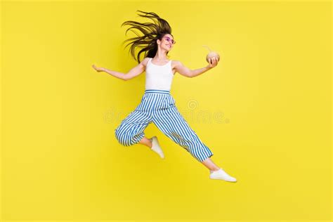 Full Body Photo Of Funny Brunette Millennial Lady Jump Hold Coconut