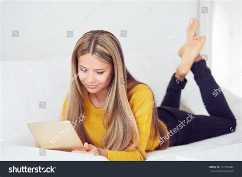 Smiling Blonde Woman Lying On Couch Stock Photo 557300842 Shutterstock