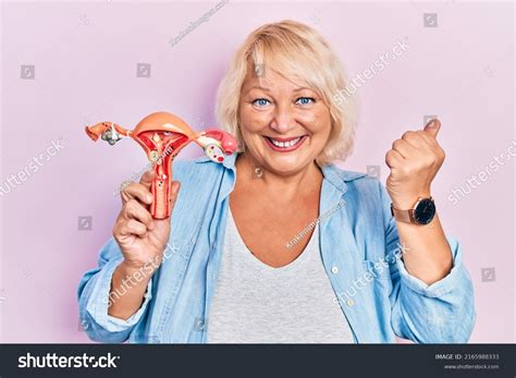 Middle Age Blonde Woman Holding Anatomical Stock Photo 2165988333 Shutterstock