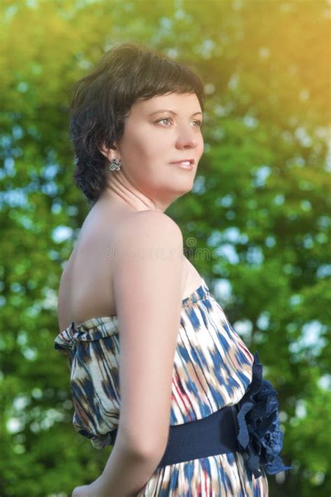 Adults Lifestyle Concepts And Ideas Smiling Brunette Caucasian Female Posing Outdoors On Nature