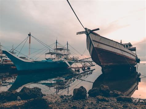 Premium Photo Ship Moored At Harbor Against Sky