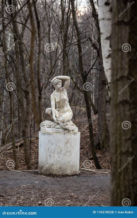 Statue Of A Seated Half Naked Woman In A Park Royalty Free Stock Image CartoonDealer