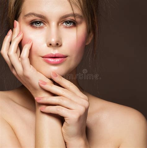 Face Beauty Woman Model With Full Plump Glossy Lips And Smooth Skin Holding Hands With Nude