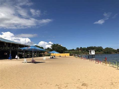 Having A Great Time With Cold Drinks At Amazing Spennah Beach In