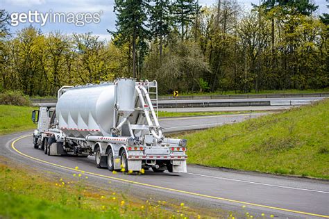 Big Rig Day Cab Semi Truck With Bulk Semi Trailer Turning On The