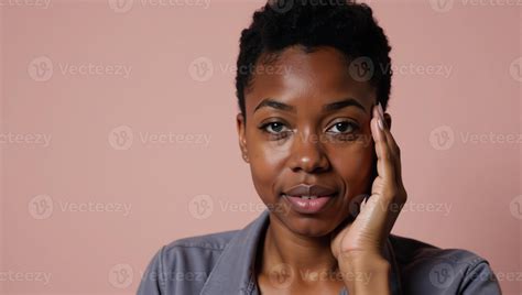 A melancholic 20year old African American woman is depicted feeling