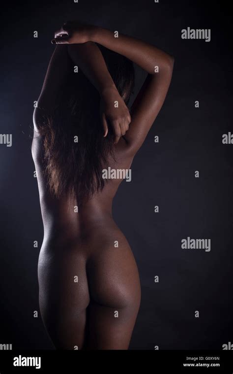 Rear View Of Sexy Nude Black Woman Over Black Background Stock Photo Alamy