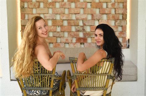 Ukrainian Woman Brunette And Russian Woman Blond Portrait Together With Long Hair Stock
