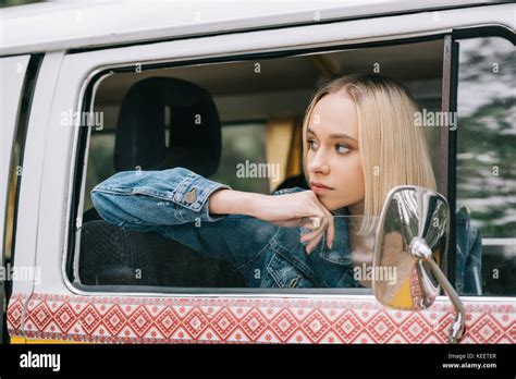 Beautiful Thoughtful Blonde Traveler Sitting In Retro Styled Minivan Stock Photo Alamy