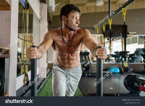 man  traction exercises dragging weights stock photo