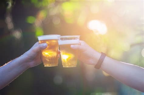 Celebration Beer Cheers Concept Close Up Hands Holding Up Glasses Of