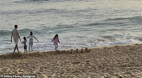 Abbey Clancy Flaunts Her Incredible Figure In A TINY Beige Snakeskin Bikini In Beach Shoot