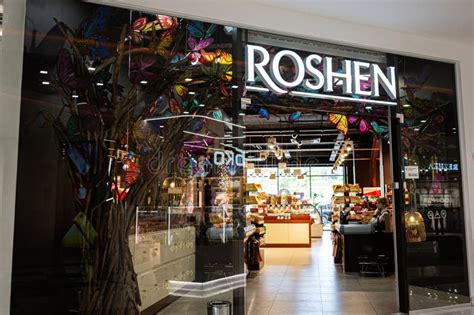 Storefront Roshen with Decorative Elements and Illuminated Signage