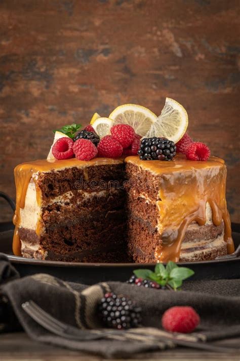 Delicious Semi Naked Chocolate Cake With Caramel Topping And Decorated With Blackberries And
