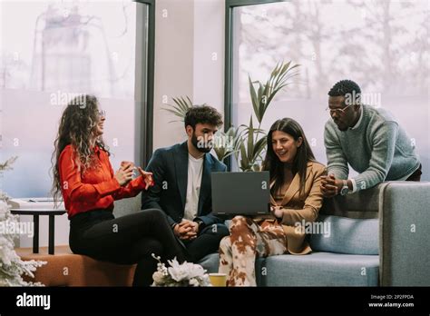 Brunette Businesswoman Joking With Her Male Multiracial Colleagues Her Curly Haired Female