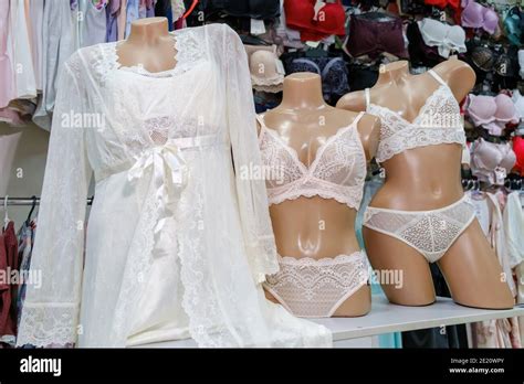 Three Mannequins Dressed In Beautiful White Lace Women S Underwear In A Lingerie Store Window