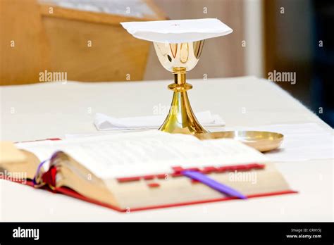 Catholic Mass A Chalice And A Prayer Book During The Religious