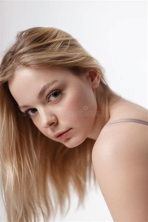 Pretty Caucasian Girl With Naked Shoulders Posing In Bra Candid Studio Portrait Stock Photo