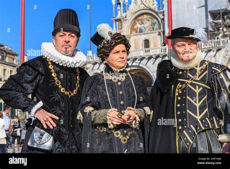 Group In Medieval Fancy Dress Costumes Pose At The Venice Carnival