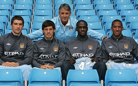 Manchester City coach Roberto Mancini riding Premier League title ...