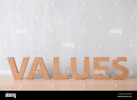 Word Values Made Of Wooden Letters On Table Stock Photo Alamy