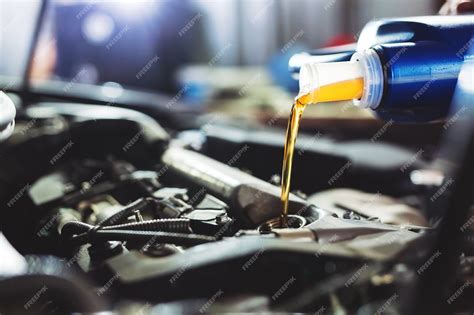 Premium Photo Motor Oil Pouring To Car Engine