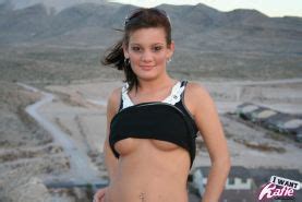 Katie Strips Out Of Her Clothes And Exposes Her Big Tits And Tight Pussy On Top Of The Hill With