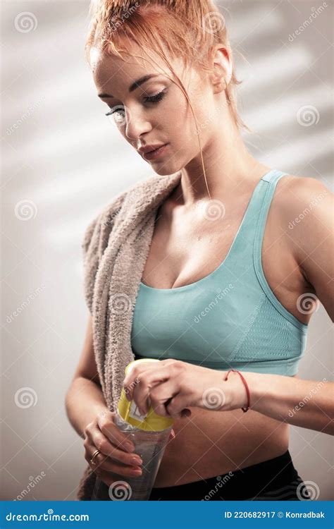 Portrait Of Sweaty Blonde Woman Take A Break After Intense Workout Royalty Free Stock