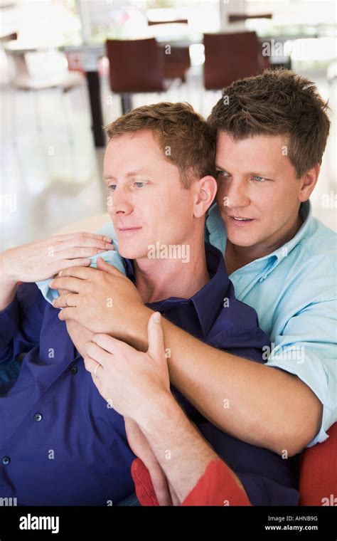 Gay Couple Relaxing On Couch Stock Photo Alamy