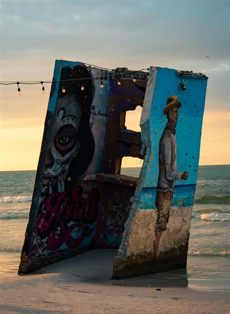 Vandalized Concrete Structure on the Shore of a BeachFree Stock Photo