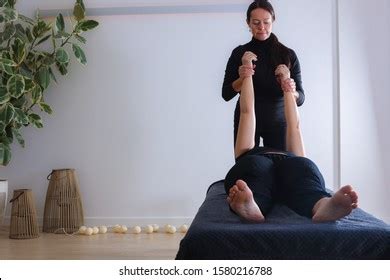 Traditional Shiatsu Massage Done By Mature Stock Photo