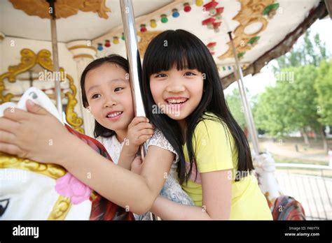 Girls On Carousel Stock Photo Alamy