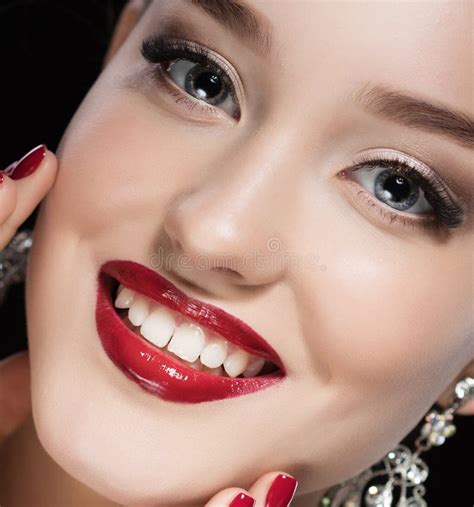 Beautiful Brunette Woman With Bright Make Up And Jewelry Earrings Smiling Close Up Red Lips And