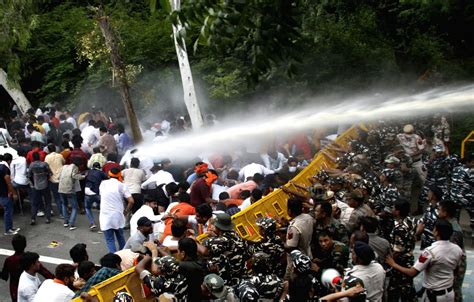 Police Personnel Use Water Cannons To Disperse Bjym Members