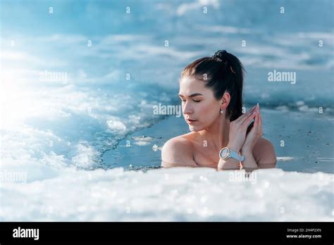 Girl With Bikini And A Watch In Frozen Lake Ice Hole Woman Hardening The Body In Cold Water