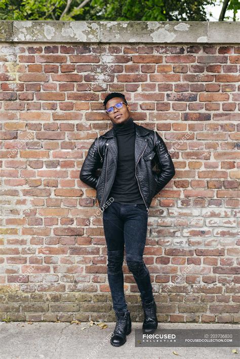 Man Standing Against Brick Wall Clothes Trendy Stock Photo