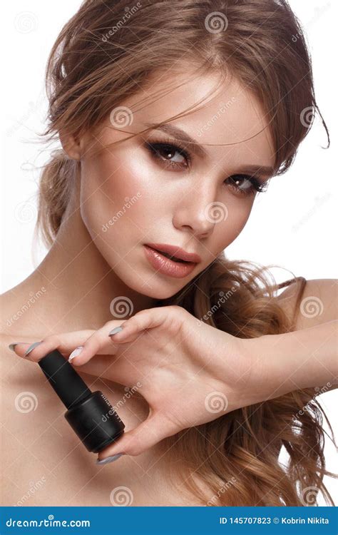 Pretty Girl With Easy Hairstyle Classic Makeup Nude Lips And Manicure Design With Jar Of Nail
