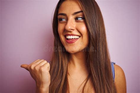 Young Beautiful Woman Wearing T Shirt Standing Over Isolated Pink