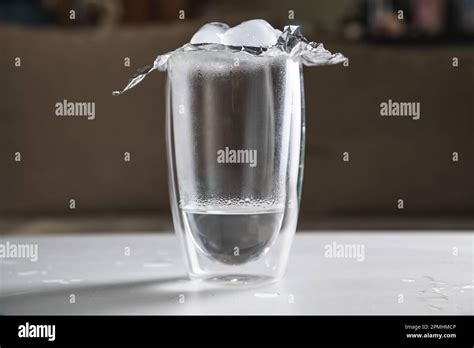 A Schoolgirl Conducts An Experiment With Hot Water And Ice Experience Getting Clouds In A Glass