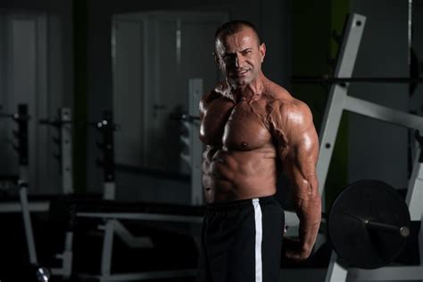 Premium Photo Portrait Of A Mature Physically Fit Man Showing His Well Trained Body Muscular