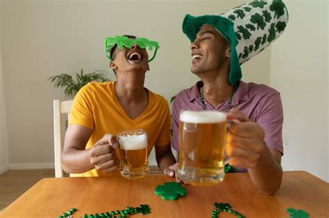 Premium Photo Diverse Gay Male Couple Wearing St Patrick S Day Costumes Laughing And Holding