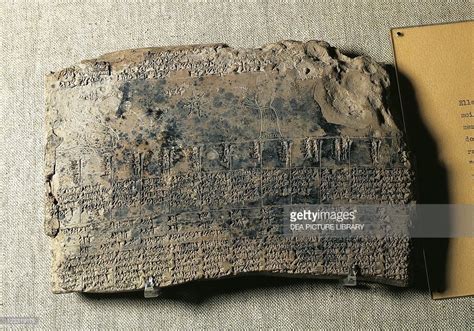 an ancient stone tablet with writing on it