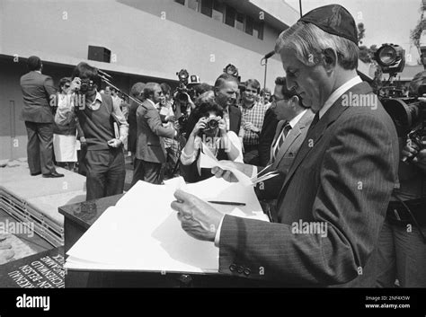 Presidential Candidate Walter Mondale Wearing A Yarmulke Signs The