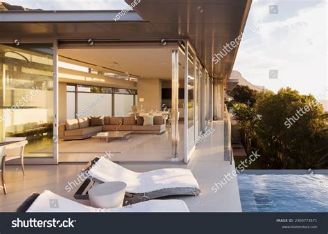 lounge chairs poolside modern house stock photo  shutterstock
