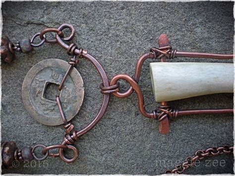 A Metal Chain With A Piece Of Wood On Top Of It Next To A Hammer