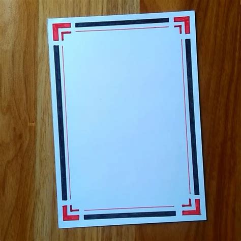 A Piece Of White Paper With Red Black And Blue Lines On It Sitting On