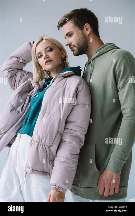 Stylish Blonde Girl And Bearded Man In Autumn Outfits Isolated On Grey Stock Photo Alamy